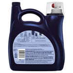 Dark navy plastic laundry detergent jug showing the back label with usage icons, warnings, barcode and a clear dosing cap on top