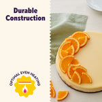 Close-up of a cheesecake garnished with orange slices beside copy reading “Durable Construction”