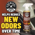 Chemical Guys leather-scent odor eliminator bottle on a car seat with logo and text about reducing new odors over time