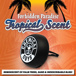 Close-up product shot of a Chemical Guys vent clip on an orange tropical background with 'Forbidden Paradise Tropical Scent' headline