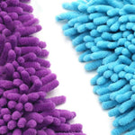 Macro close-up of purple and blue chenille microfiber mop fibers showing soft noodle-like strands.