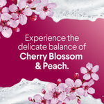 Graphic with cherry blossom flowers and foam surrounding copy that promotes the Cherry Blossom & Peach scent