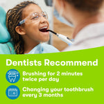 Lifestyle image of a child at the dentist smiling with dental instrument above and oral health tips below