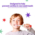 Child brushing teeth with Colgate kids toothbrush, promotional text about preventing cavities and star graphics