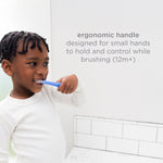 Young child brushing with a blue toddler toothbrush next to text about an ergonomic handle for small hands.