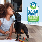 Child and small dog on a hardwood floor next to a large EPA Safer Choice logo panel promoting safer product standards.