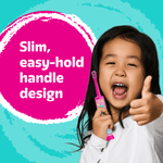 Smiling child holding a pink Barbie electric toothbrush beside text that says 'Slim, easy-hold handle design' on turquoise background.