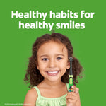 Smiling child holding a Minecraft-themed toothbrush with the headline 'Healthy habits for healthy smiles' on green background