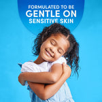 Lifestyle-style image of a smiling child hugging laundry with headline about being gentle on sensitive skin