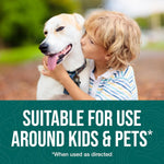 Child kissing a seated dog above a green panel stating 'Suitable for use around kids & pets' with fine-print asterisk