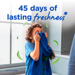 Child smelling a blue garment in a laundry room with floating green leaves and text about 45 days of lasting freshness