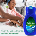 Lifestyle image of a child washing dishes at a sink with an enlarged Palmolive Ultra Oxy bottle in the foreground