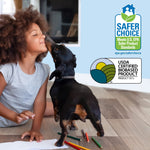 Child on a hardwood floor being licked by a small dog, with Safer Choice and USDA Certified Biobased Product logos visible at top right.