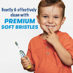 Smiling child holding a Firefly Baby Shark toothbrush with text promoting premium soft bristles