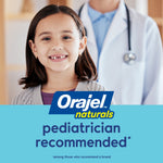Smiling child in front of a pediatrician with Orajel Naturals logo and text stating pediatrician recommended