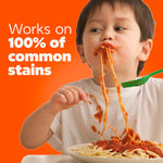 Child eating spaghetti with visible sauce stains and text claiming Tide works on 100% of common stains.