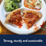 Close-up of a Chinet white compartment plate with two pizza slices and sides, showing sauce and crumbs on the rim.