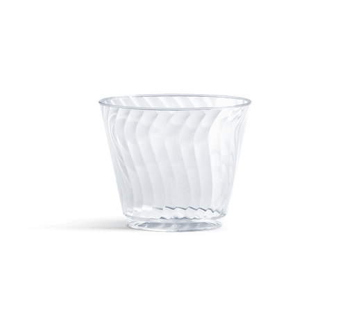 Clear Chinet Crystal disposable plastic cup with diagonal swirl pattern on white background, casting a soft shadow