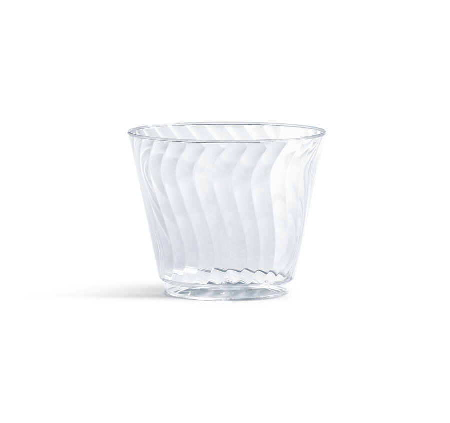 Clear Chinet Crystal disposable plastic cup with diagonal swirl pattern on white background, casting a soft shadow