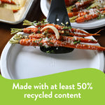 Close-up of grilled carrots being served on a white Chinet paper plate showing embossed Chinet logo and 'recycled content' graphic.
