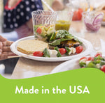 Lifestyle scene of a prepared plate on a counter with salad and burger on a Chinet disposable plate