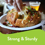 Close lifestyle shot of a filled Chinet platter holding a pull-apart cheesy bread appetizer, 'Strong & Sturdy' graphic area