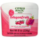 Close-up of a Citrus Magic Auto Dragonfruit solid air freshener can with pink label