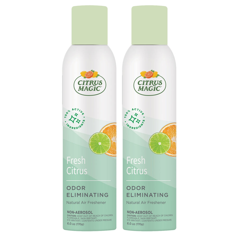 Two Citrus Magic Fresh Citrus odor-eliminating spray cans with light green caps and citrus graphics on white labels.