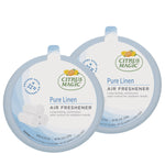 Two Citrus Magic Pure Linen air freshener canisters shown side-by-side with product labels visible