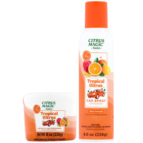 Two Citrus Magic Tropical Citrus car air fresheners: an orange-capped spray can and a white tub solid on a white background