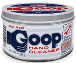 Close-up of a round metal tin of Classic Goop hand cleaner with blue and red logo label
