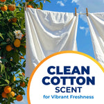 White sheets hanging on a clothesline with oranges on a tree and 'clean cotton scent' badge overlay