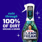 Close-up of a Mr. Clean Clean Freak spray bottle with text claiming it cuts through 100% of dirt, grease and grime.