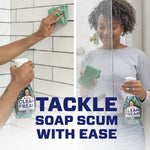 Split image of hands cleaning tiled shower and glass with Mr. Clean Clean Freak spray tackling soap scum