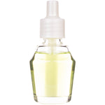 Close-up of a clear glass aroma oil refill bottle with pale yellow liquid and a white plastic cap