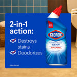 Clorox toilet bowl cleaner bottle placed against a bathroom scene with text highlighting 2-in-1 action destroys stains and deodorizes