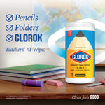 Single Clorox disinfecting wipes canister on a desk with school supplies and text calling it ‘Teachers’ #1 Wipe.’