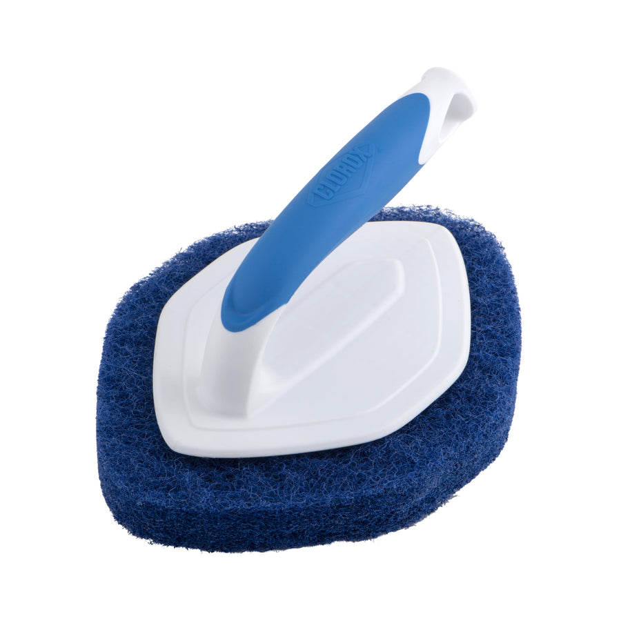 Blue-and-white Clorox handheld diamond-shaped scrubber with thick blue scouring pad, angled view