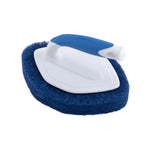 Clorox diamond-shaped handheld scrubber showing white plastic top and blue ergonomic handle with scouring pad