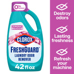 Close-up studio image of a teal Clorox FreshGuard laundry odor remover bottle with purple cap and Fresh Meadow label