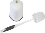 White toilet brush with black rubber grip lying next to a matching white plastic holder viewed from above