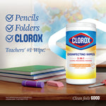 Single Clorox disinfecting wipes canister styled in a teacher's desk scene with notebooks and pencils