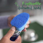 Close-up of fingers removing or attaching a blue replaceable Scotch-Brite dishwand head over a clear handle