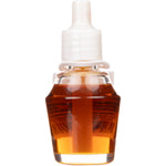 Close-up of a clear glass fragrance oil refill bottle with visible amber liquid and a white cap on white background