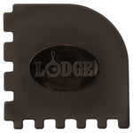 Close-up of a black Lodge multi-tooth scraper with an oval Lodge logo recessed in the center of the tool.
