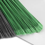 Close-up of green and gray broom filaments fanned out on a white background