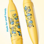 Close-up of two yellow Ordo Sonic Kids toothbrush handles decorated with multiple Minions characters and ORDO logo.