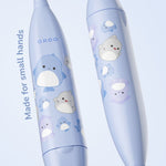 Close-up of two blue Ordo toothbrush handles decorated with Squishmallows characters and text reading 'Made for small hands'.