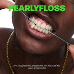 Close-up of a person flossing with blue dental floss and pearlyfloss branding text across the image