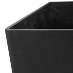 Close-up detail of the rim and textured surface of a black recycled slate-style planter